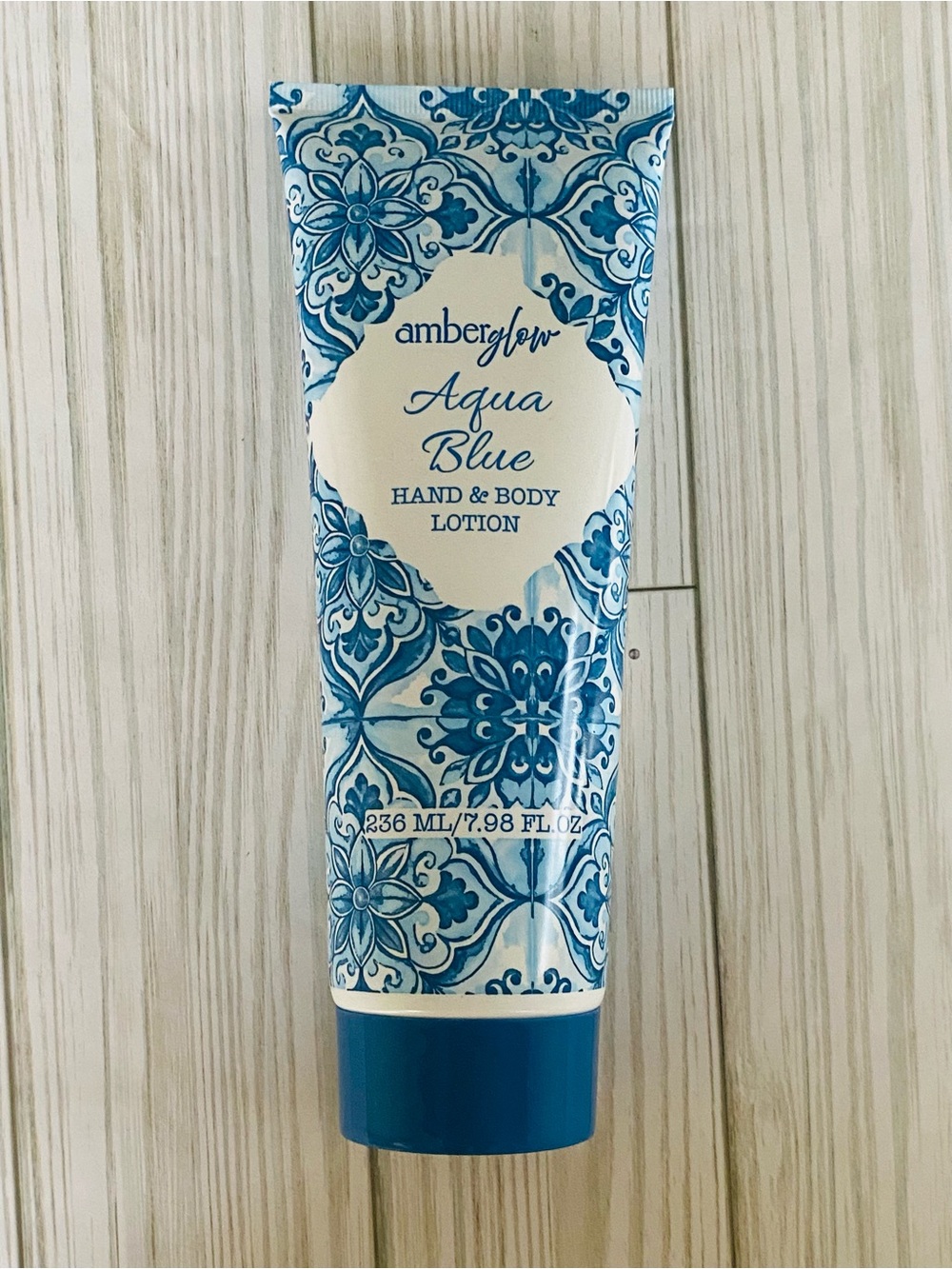 3/$10 Amber Glow Hand & Body Lotion AQUA BLUE